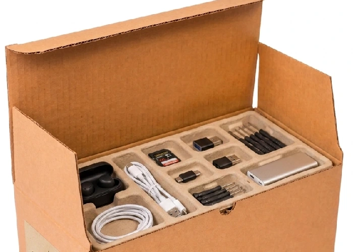 Electronics and accessories organized inside small packaging boxes to prevent transit damage