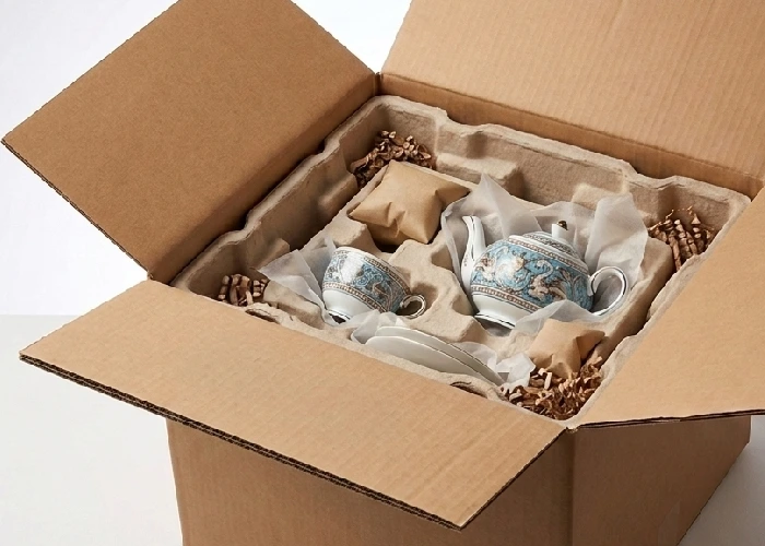A delicate product sitting securely inside a reinforced courier box with protective padding.